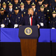 Standing in front of uniformed law enforcement officers in dress blues in Brentwood, N.Y., last July, President Trump said he supported the police — and also suggested that officers treat suspects rougher: “Like when you guys put somebody in the car, and you’re protecting their head — the way you put the hand over — like don’t hit their head, and they’ve just killed somebody, don’t hit their head? I said, ‘You can take the hand away, okay.’ ” (Credit: Chris Ware and Jeffrey Basinger/Newsday)